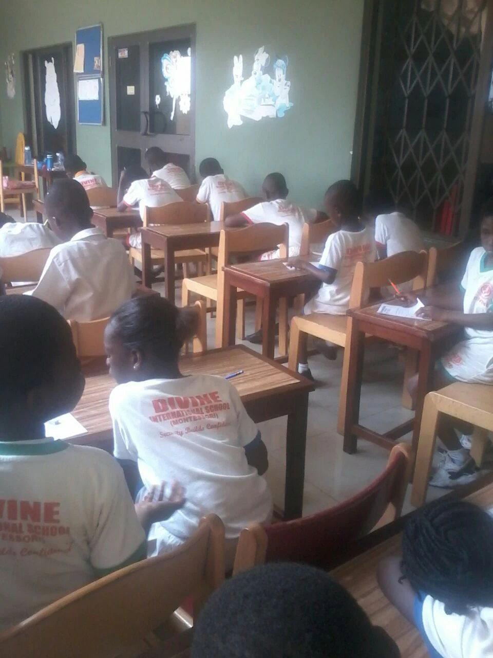 A Divine International School historical photograph showing an early divine classroom.